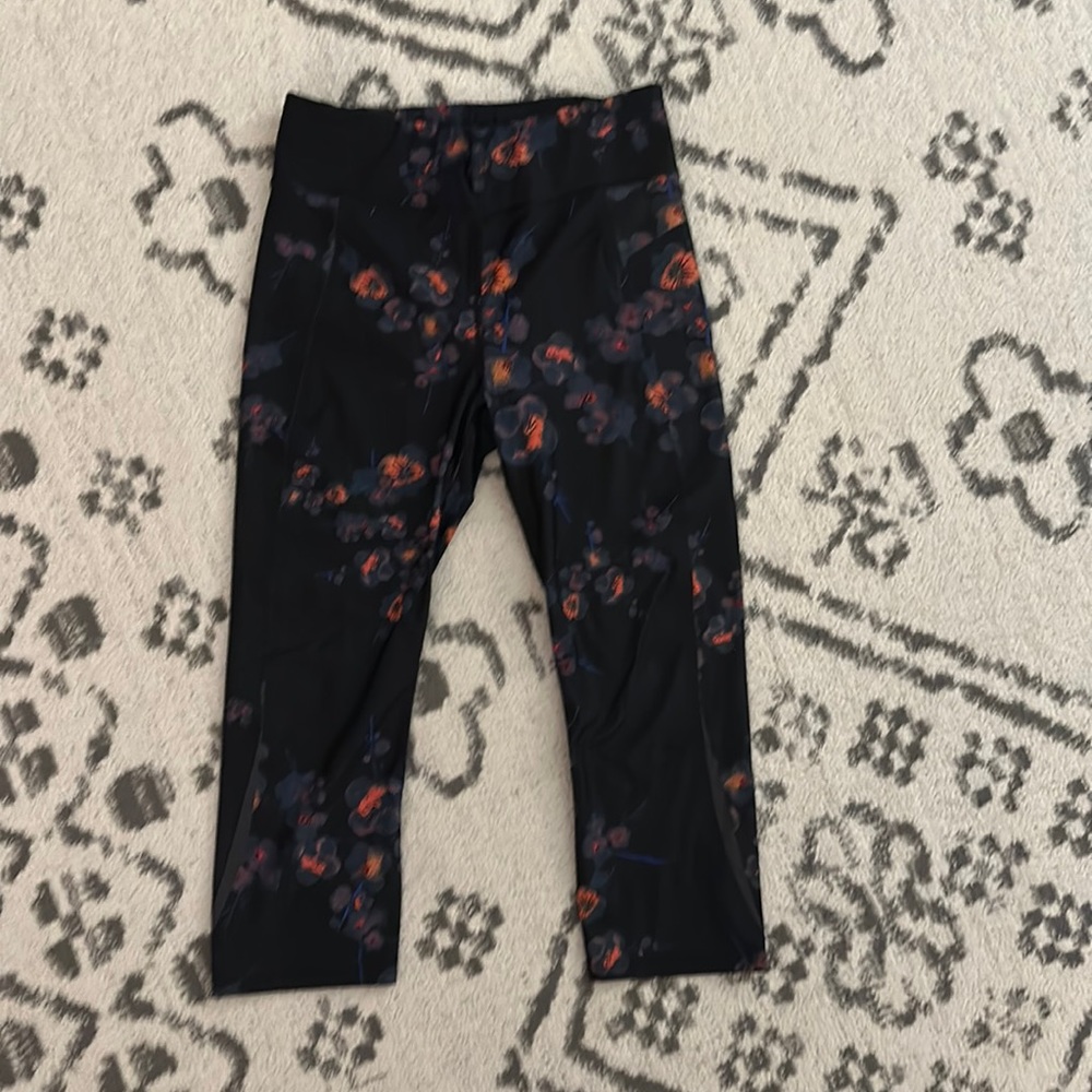 Sweaty Betty Black Floral Leggings with Orange and Purple Accents
